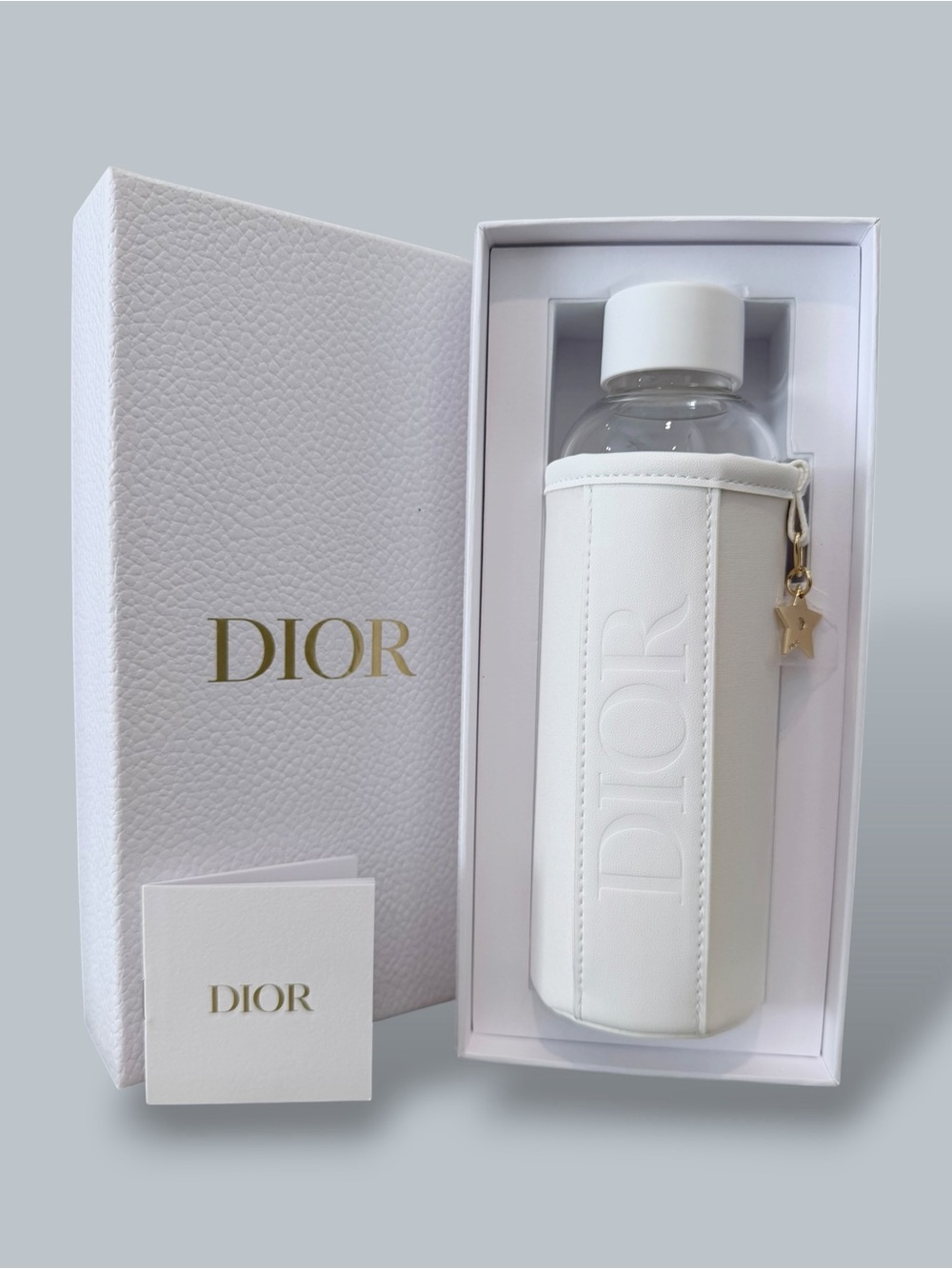 Dior Glass Bottle with protective sleeve/ holder